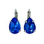 A pair of Mariana royal blue teardrop earrings with a rhodium finish.