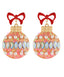 A pair of ornate Christmas ornament-shaped drop earrings with red bow tops, gold caps, and pink marbled bodies decorated with faux pearls and iridescent oval rhinestones, shown on a plain white background.