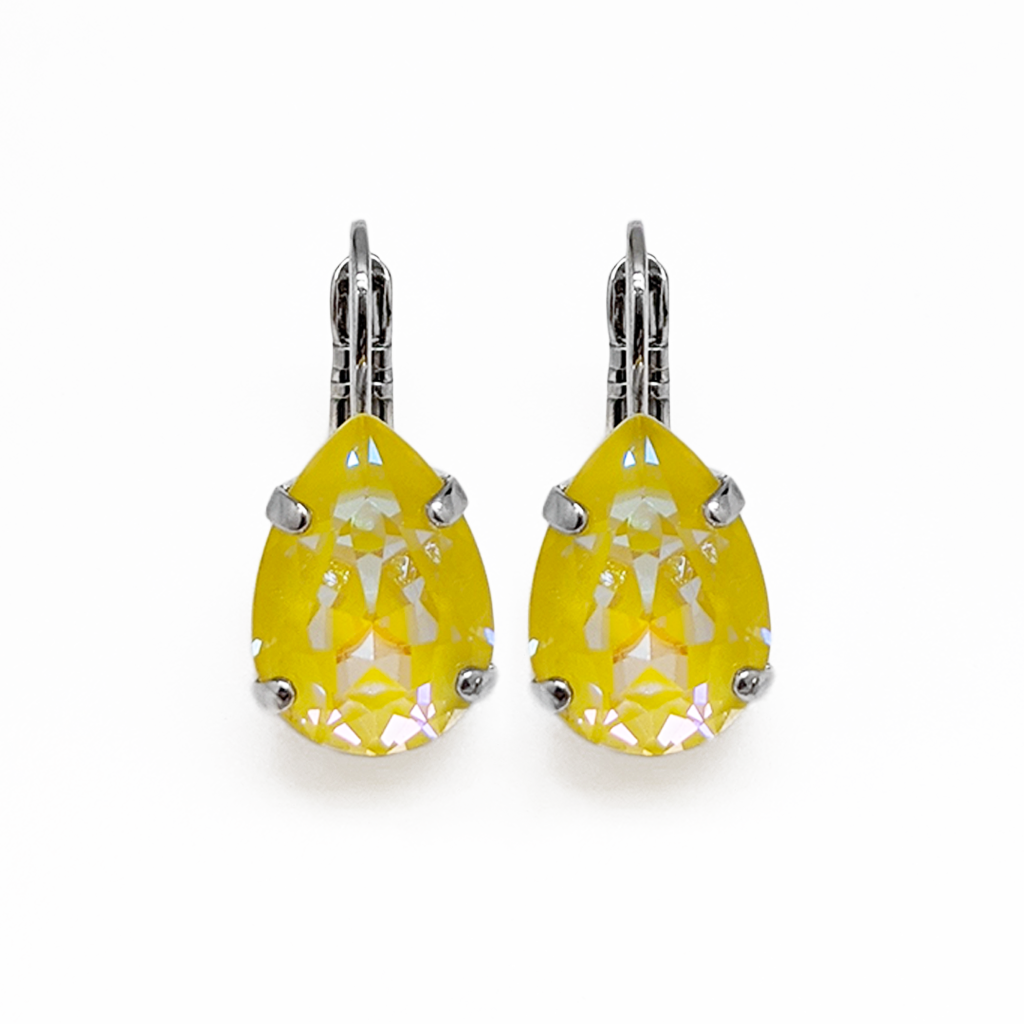 A pair of Mariana yellow teardrop shaped earrings with a rhodium finish.