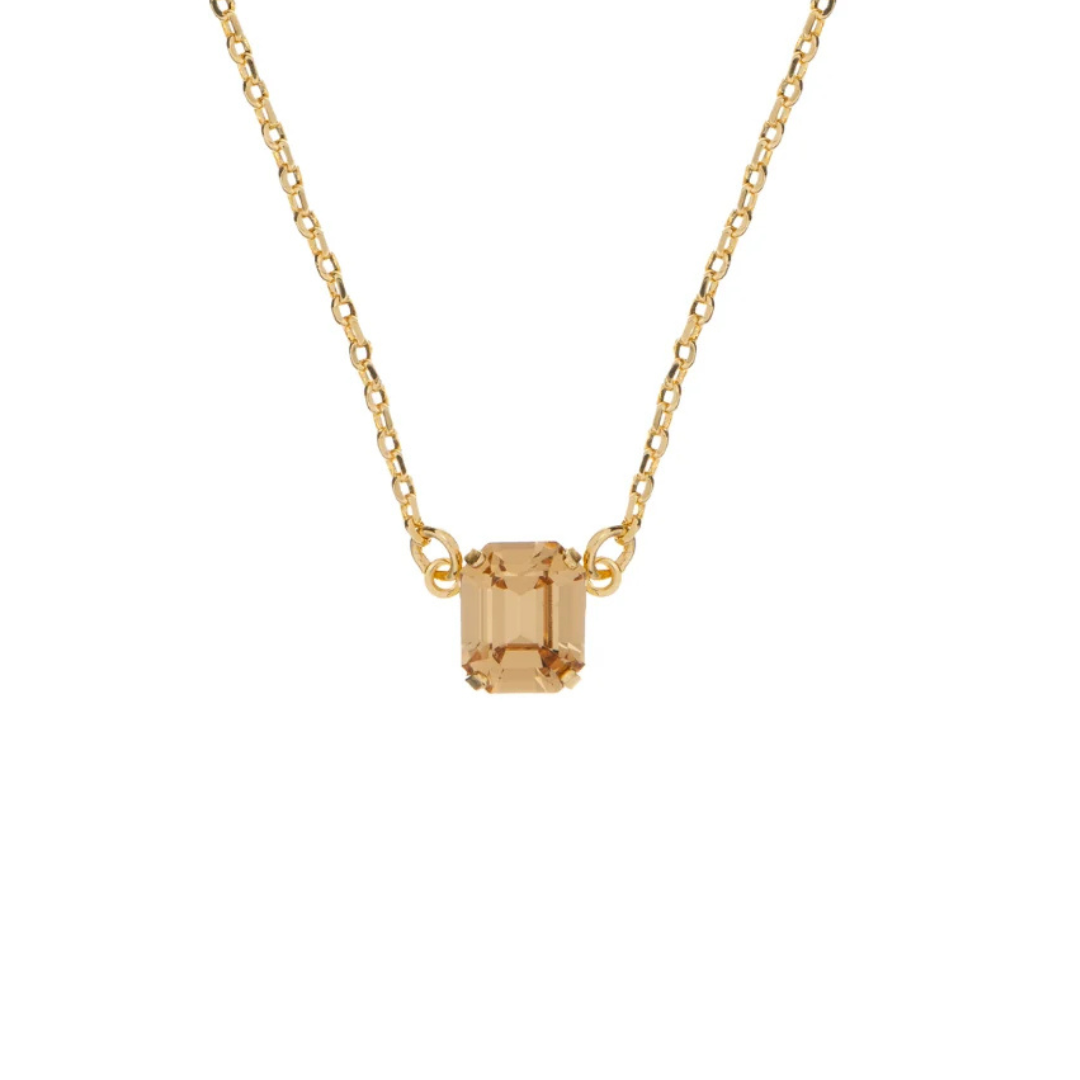 This cute pendant features a medium sized emerald shaped crystal!
Chain is approximately 13 inches long with a 2 inch extender. Pendant is approximately 1/2 inch wide and 1/4 inch in height. 
Color 246: Light Colorado Topaz.