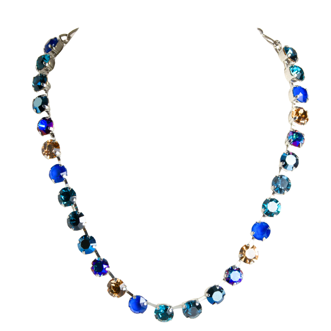 A handmade silver-tone necklace featuring a gradient of faceted round rhinestones transitioning from deep blue to light blue, teal, and amber-brown, displayed on a solid white background. Main image
