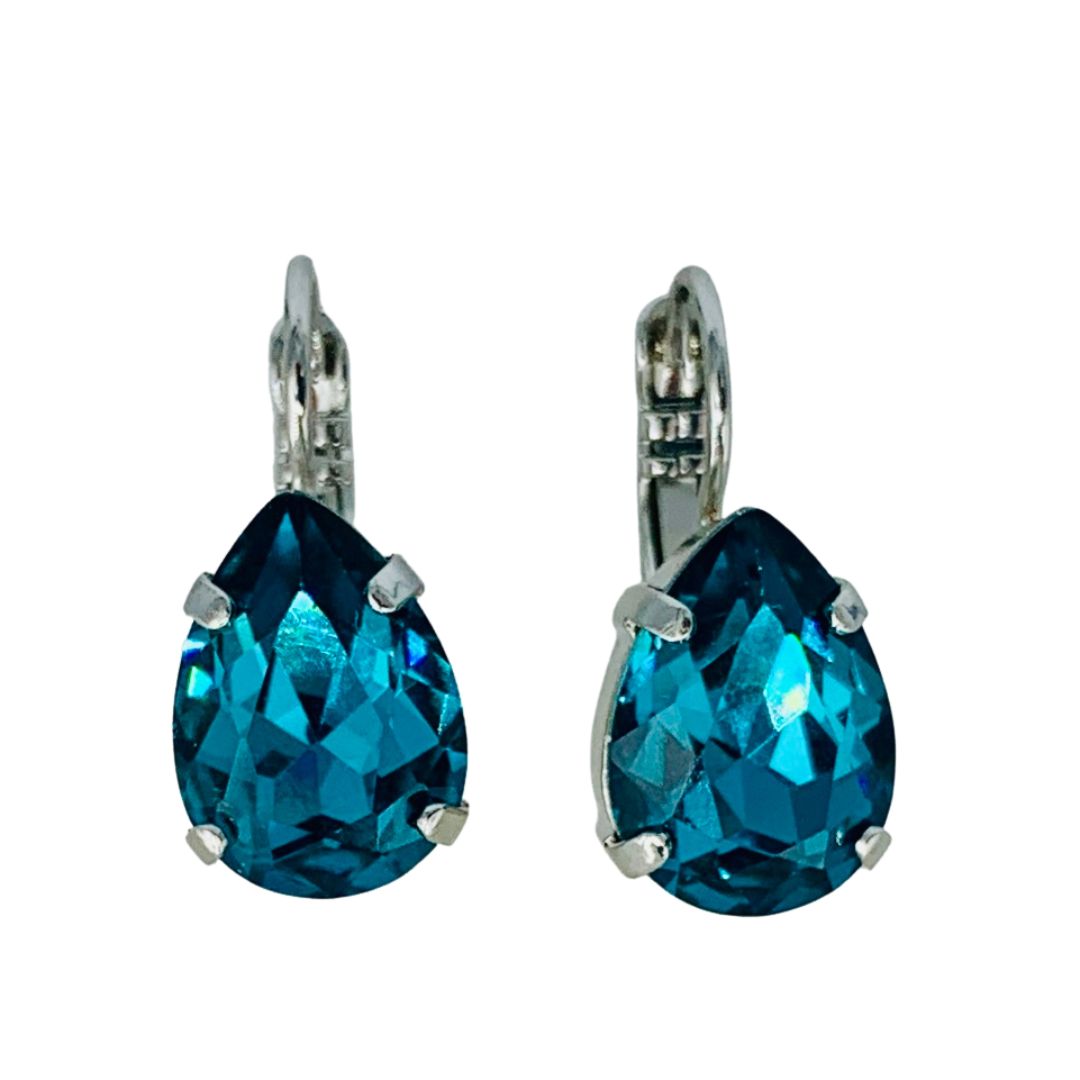 A pair of Mariana teardrop shaped earrings with a medium size, crafted in a rhodium-plated setting, featuring a blue color. Main image