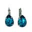 A pair of Mariana teardrop shaped earrings with a medium size, crafted in a rhodium-plated setting, featuring a blue color.