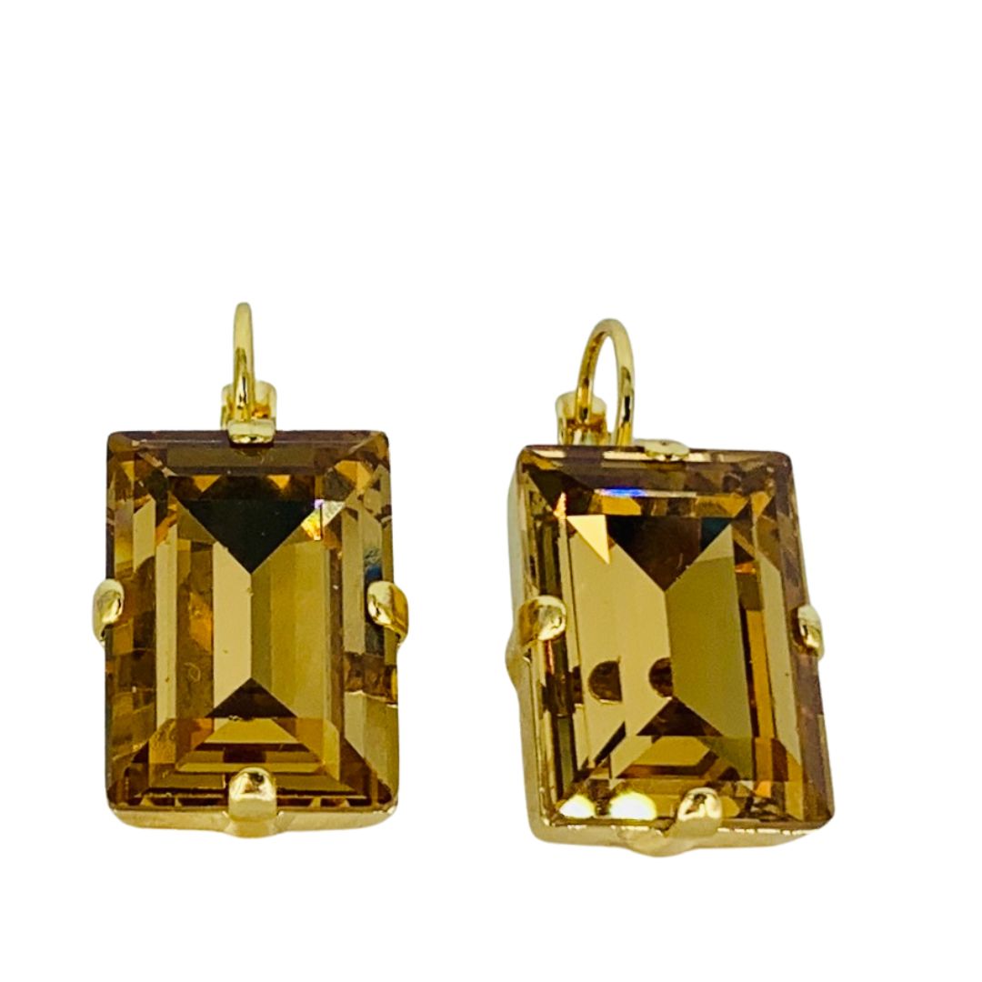 A pair of  Mariana emerald cut amber earrings on rose gold hooks.