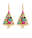 A pair of gold-tone dangle earrings shaped like Christmas trees, decorated with multiple colorful faux gemstones in pink, blue, green, purple, and red on a plain white background.